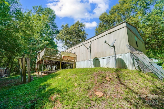 view of outdoor structure with a lawn