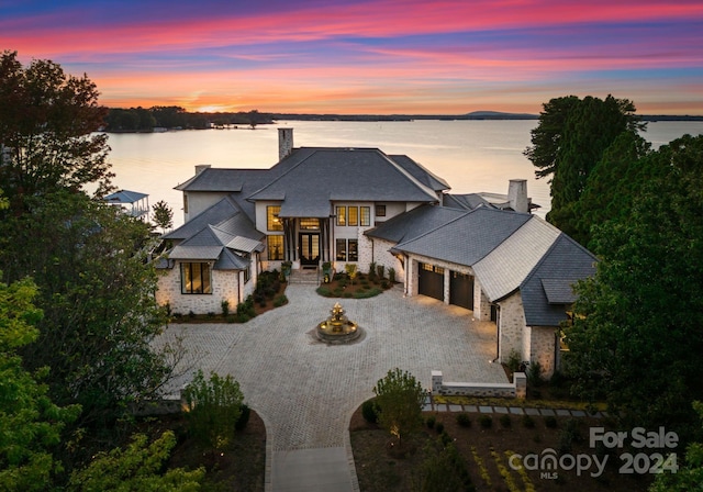 view of front of home with a water view