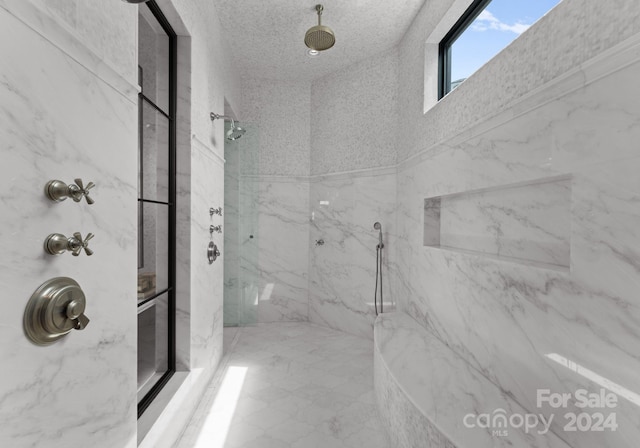bathroom featuring tiled shower