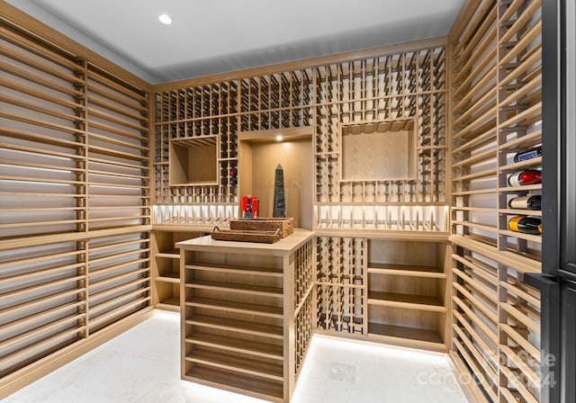 wine area featuring tile patterned floors