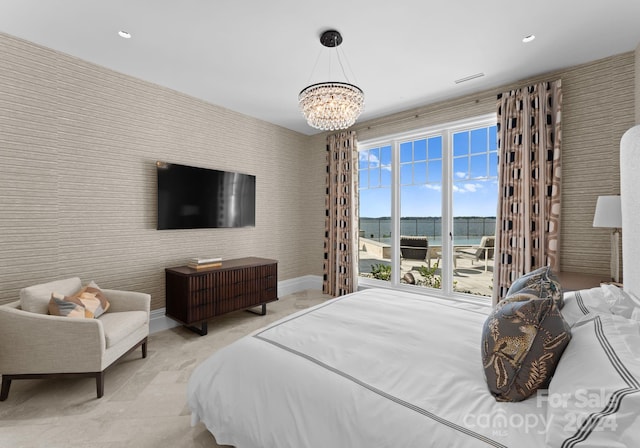 bedroom with multiple windows and a chandelier