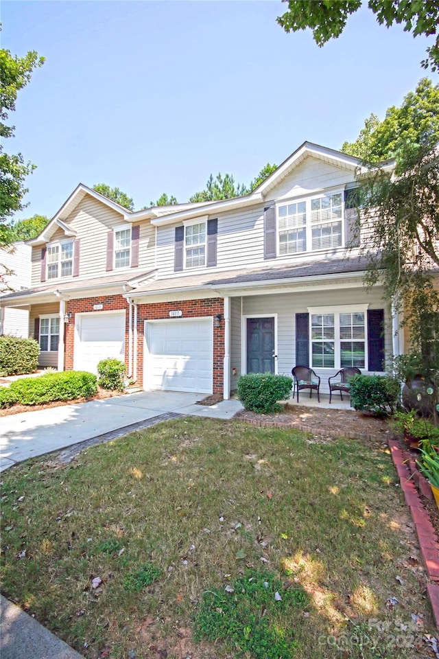 view of front facade with a garage and a front yard