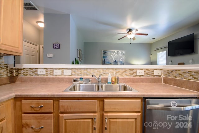 kitchen with sink, light brown cabinets, ceiling fan, decorative backsplash, and stainless steel dishwasher