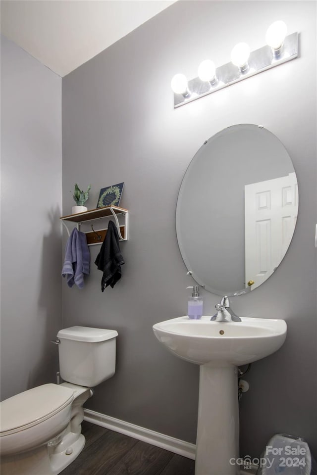 bathroom featuring toilet and hardwood / wood-style flooring