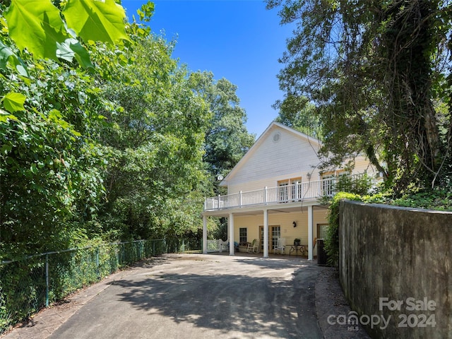 view of front of house with a balcony