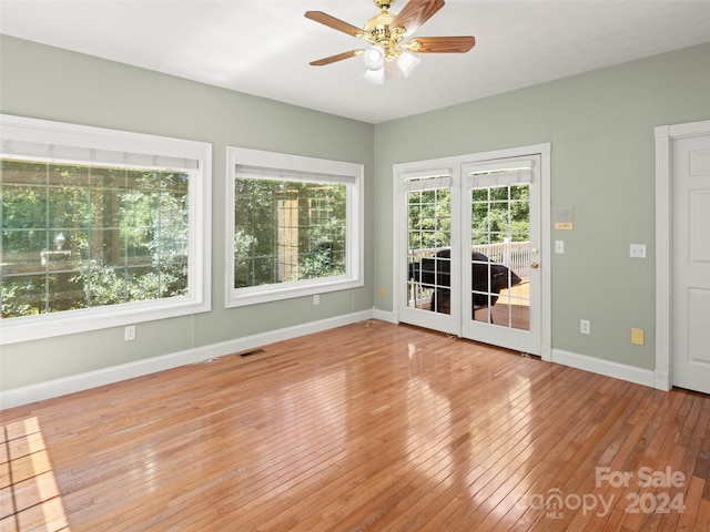 interior space with ceiling fan and light hardwood / wood-style floors