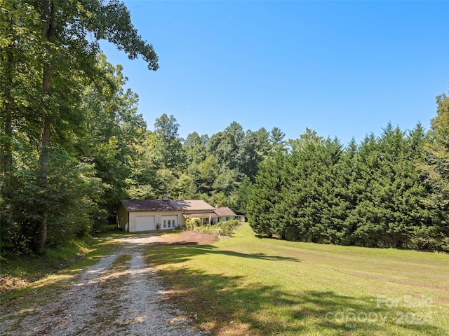 view of yard featuring a garage