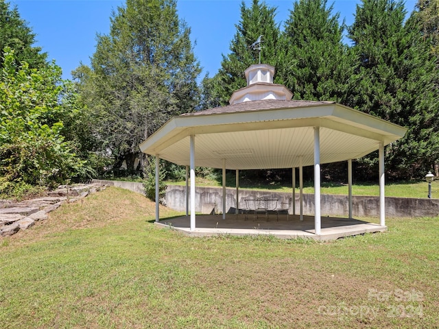 exterior space featuring a patio area, a yard, and a gazebo