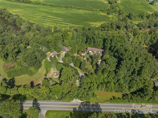 birds eye view of property with a rural view