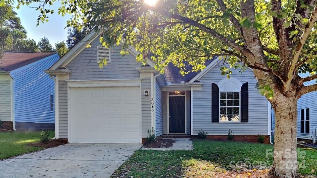 view of front of property with a garage