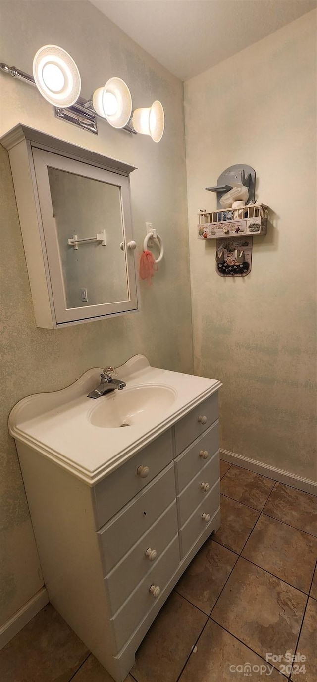 bathroom with tile patterned flooring and vanity