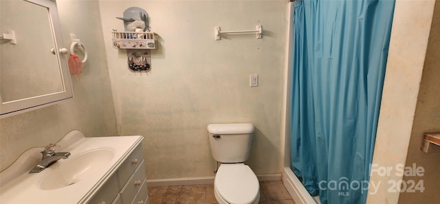 bathroom with tile patterned floors, vanity, toilet, and a shower with shower curtain