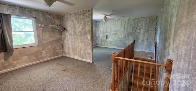 carpeted empty room with ceiling fan