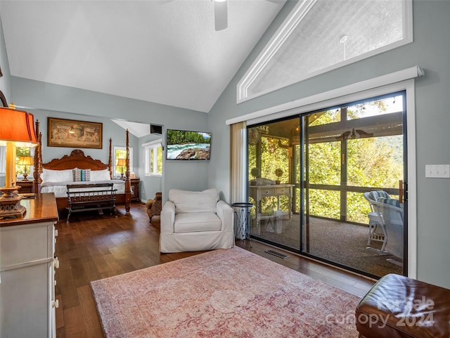 living room with high vaulted ceiling, ceiling fan, plenty of natural light, and dark hardwood / wood-style flooring