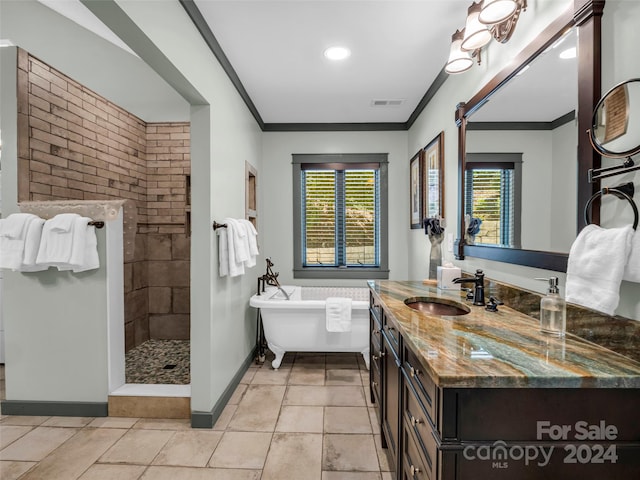 bathroom with ornamental molding, vanity, and separate shower and tub