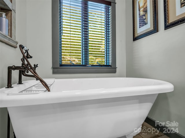 bathroom featuring a tub to relax in