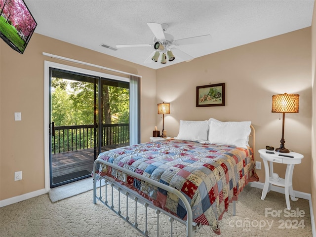 carpeted bedroom featuring a textured ceiling, access to outside, and ceiling fan