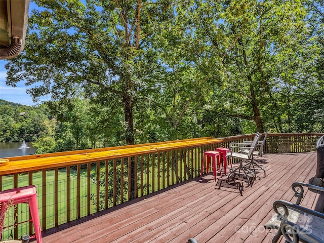 wooden deck with a water view