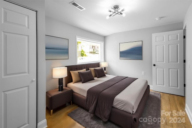 bedroom with light wood-type flooring