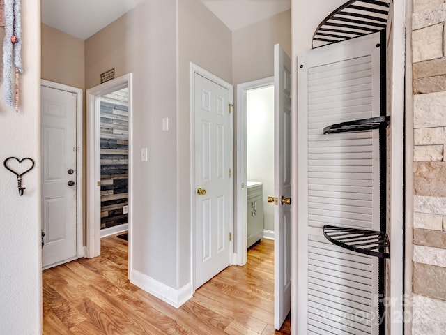 corridor featuring light hardwood / wood-style floors