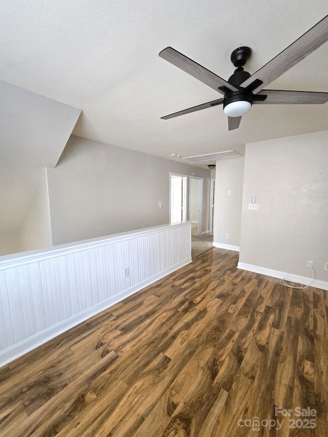 unfurnished room with dark hardwood / wood-style floors and ceiling fan