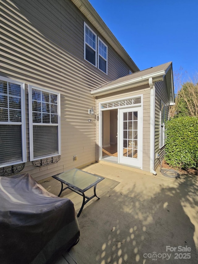 rear view of house featuring a patio