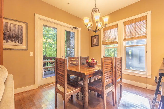 150-2 Saddle Notch Ln, Tuckasegee, NC 28783 - dining space featuring baseboards, a chandelier, light wood-style flooring, and french doors