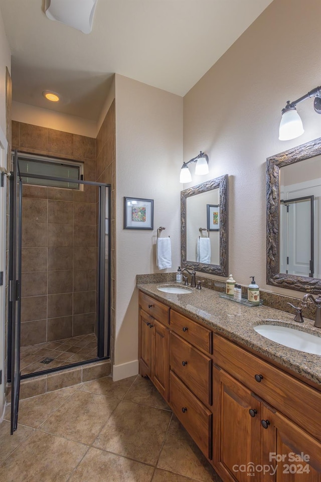 150-2 Saddle Notch Ln, Tuckasegee, NC 28783 - bathroom with a stall shower, double vanity, and tile patterned floors
