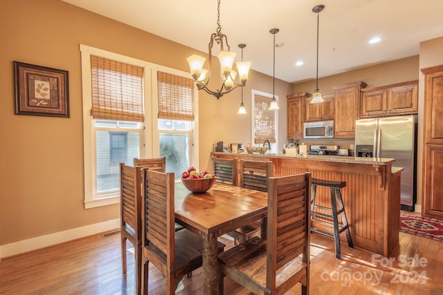 150-2 Saddle Notch Ln, Tuckasegee, NC 28783 - dining room featuring light wood-type flooring, a chandelier, baseboards, and recessed lighting