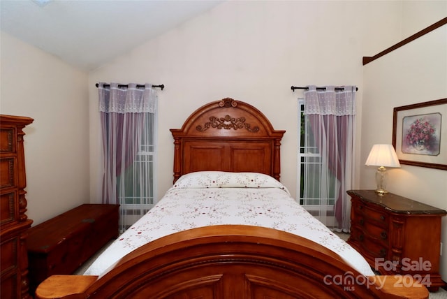 bedroom featuring vaulted ceiling