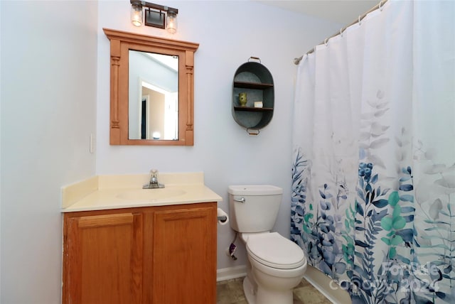 bathroom featuring toilet, a shower with curtain, vanity, and tile patterned flooring