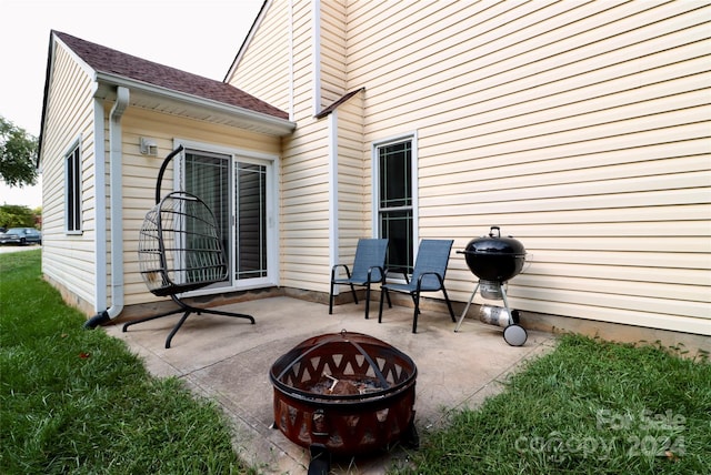 view of patio / terrace with grilling area and an outdoor fire pit