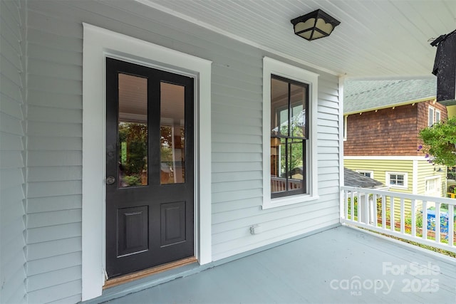 doorway to property with a porch