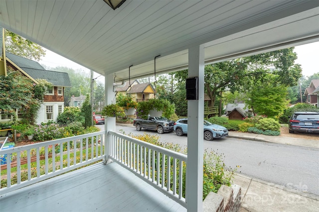 view of patio / terrace with a porch and a residential view