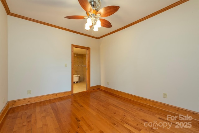 unfurnished room with ornamental molding, ceiling fan, baseboards, and wood finished floors