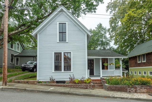 traditional home featuring covered porch