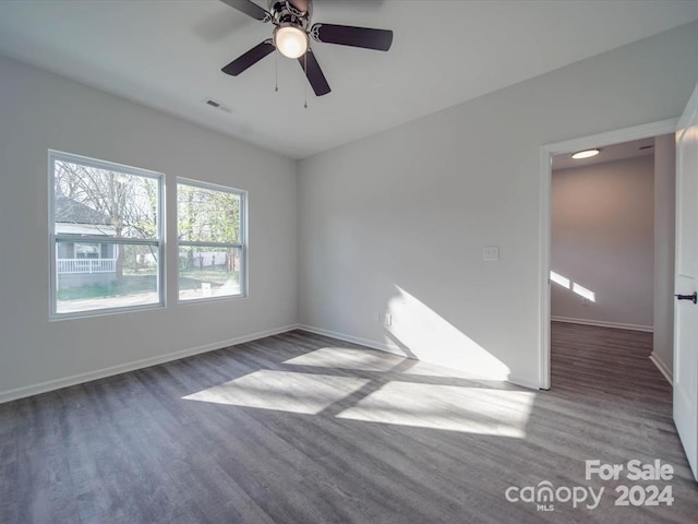 spare room featuring light hardwood / wood-style flooring and ceiling fan