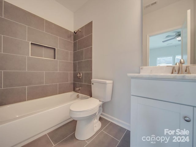 full bathroom with vanity, tile patterned flooring, toilet, ceiling fan, and tiled shower / bath combo