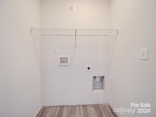 laundry room with hookup for a washing machine, wood-type flooring, and hookup for an electric dryer