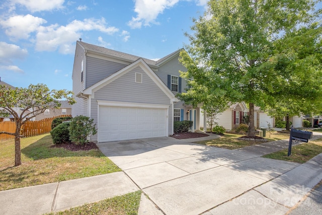 view of front facade with a garage and a front yard