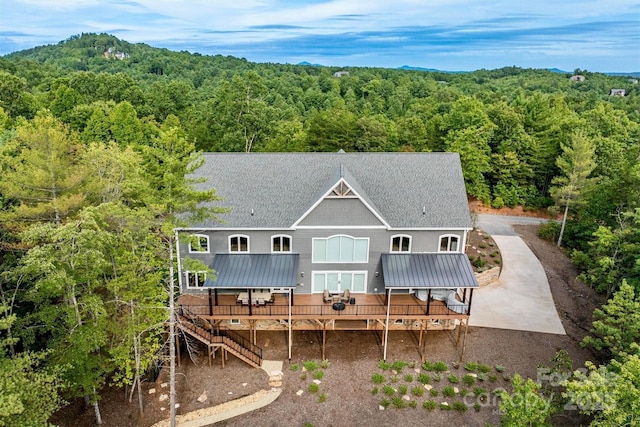 back of house featuring a deck