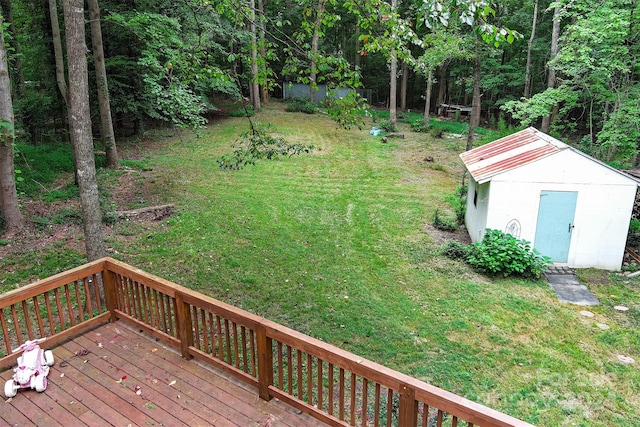 view of yard with a storage shed and a deck