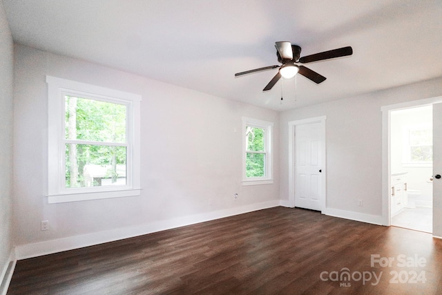 unfurnished room featuring ceiling fan and dark hardwood / wood-style floors