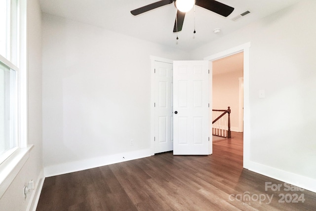 spare room featuring wood-type flooring and ceiling fan