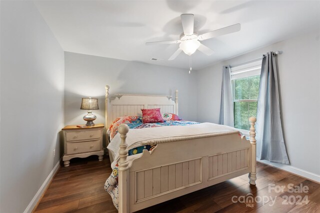 bedroom featuring dark hardwood / wood-style flooring and ceiling fan