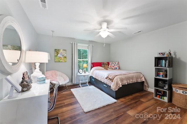 bedroom featuring ceiling fan and dark hardwood / wood-style floors