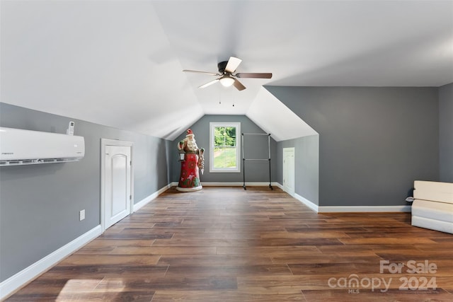 bonus room with lofted ceiling, ceiling fan, dark hardwood / wood-style flooring, and an AC wall unit