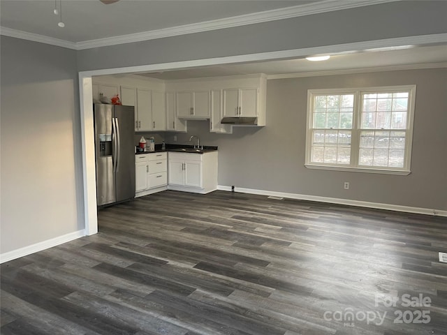 kitchen with dark wood-style floors, ornamental molding, a sink, white cabinets, and stainless steel refrigerator with ice dispenser