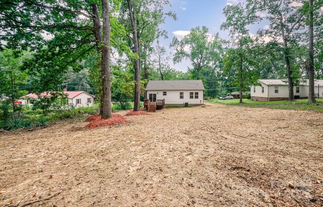 view of yard featuring a wooden deck