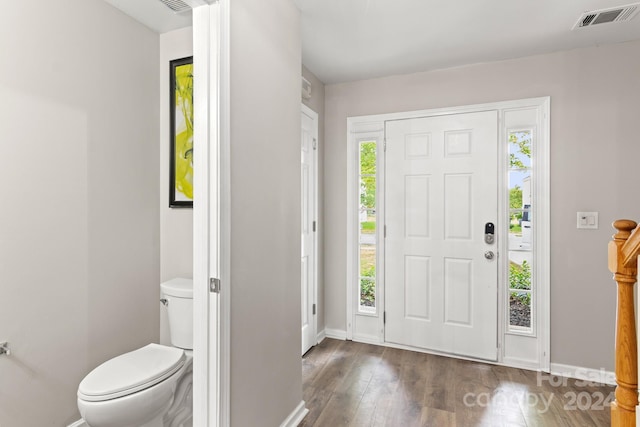 entrance foyer with dark hardwood / wood-style floors